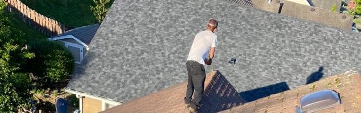 Roof inspector measuring.